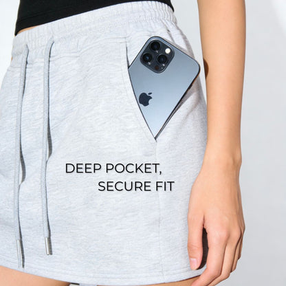 Person wearing light gray shorts with a phone in a pocket, text 'DEEP POCKET, SECURE FIT' on a white background